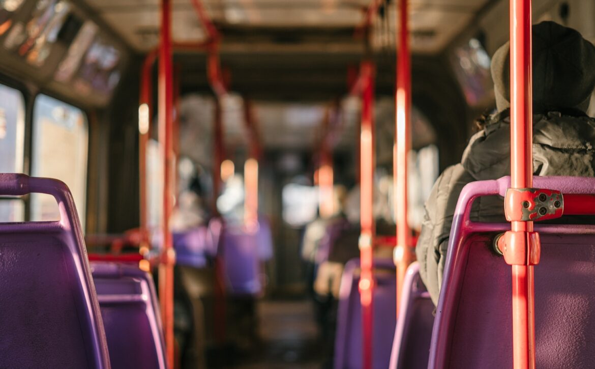 person standing in transportation vehicle