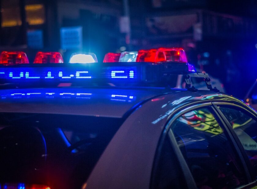 blue car on the street during night time