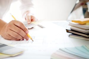 Graphic design and color swatches and pens on a desk. Architectu