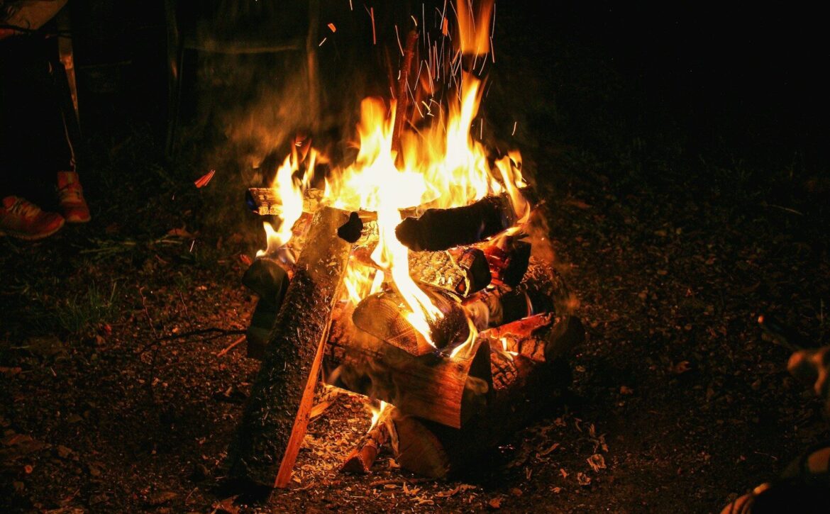 a fire burning in a campfire