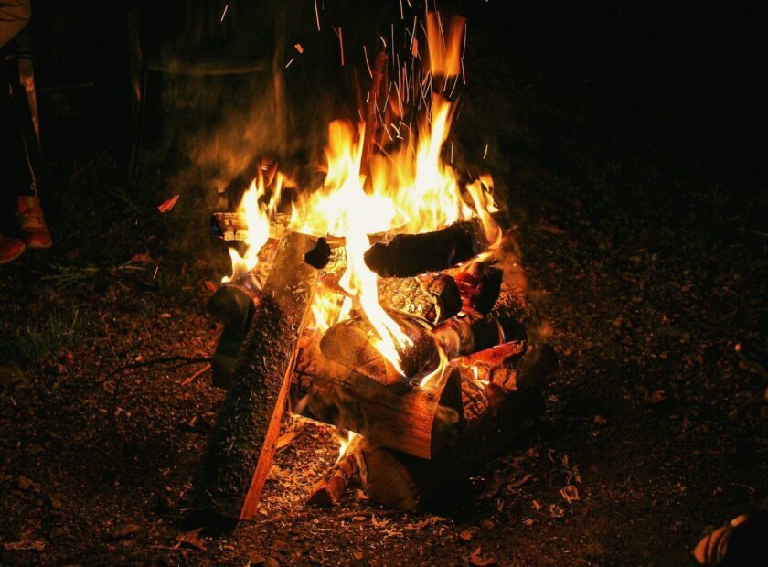 a fire burning in a campfire
